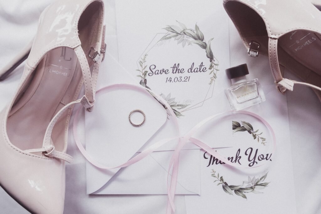 pexels-photo-7162700-7162700 A chic flat lay of wedding essentials including heels, perfume, and invitations.